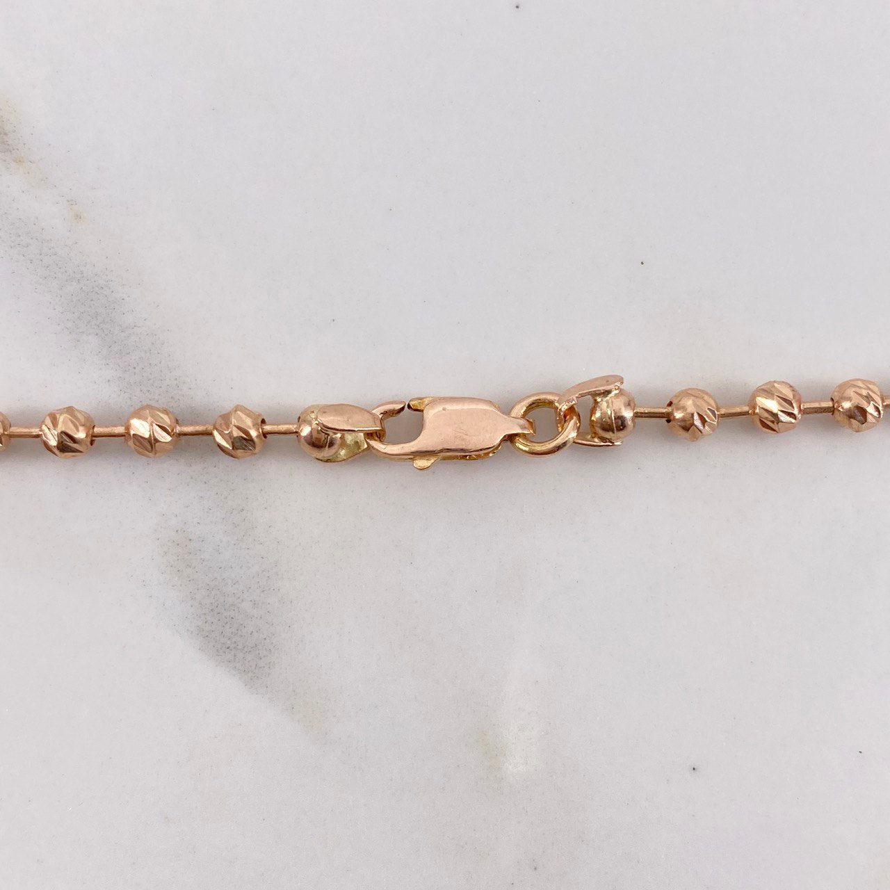 Tobillera Militar Corona 9.55gr / 28.5cm / 3mm-4mm Bolas Lisa-Diamantadas Oro Rosa $