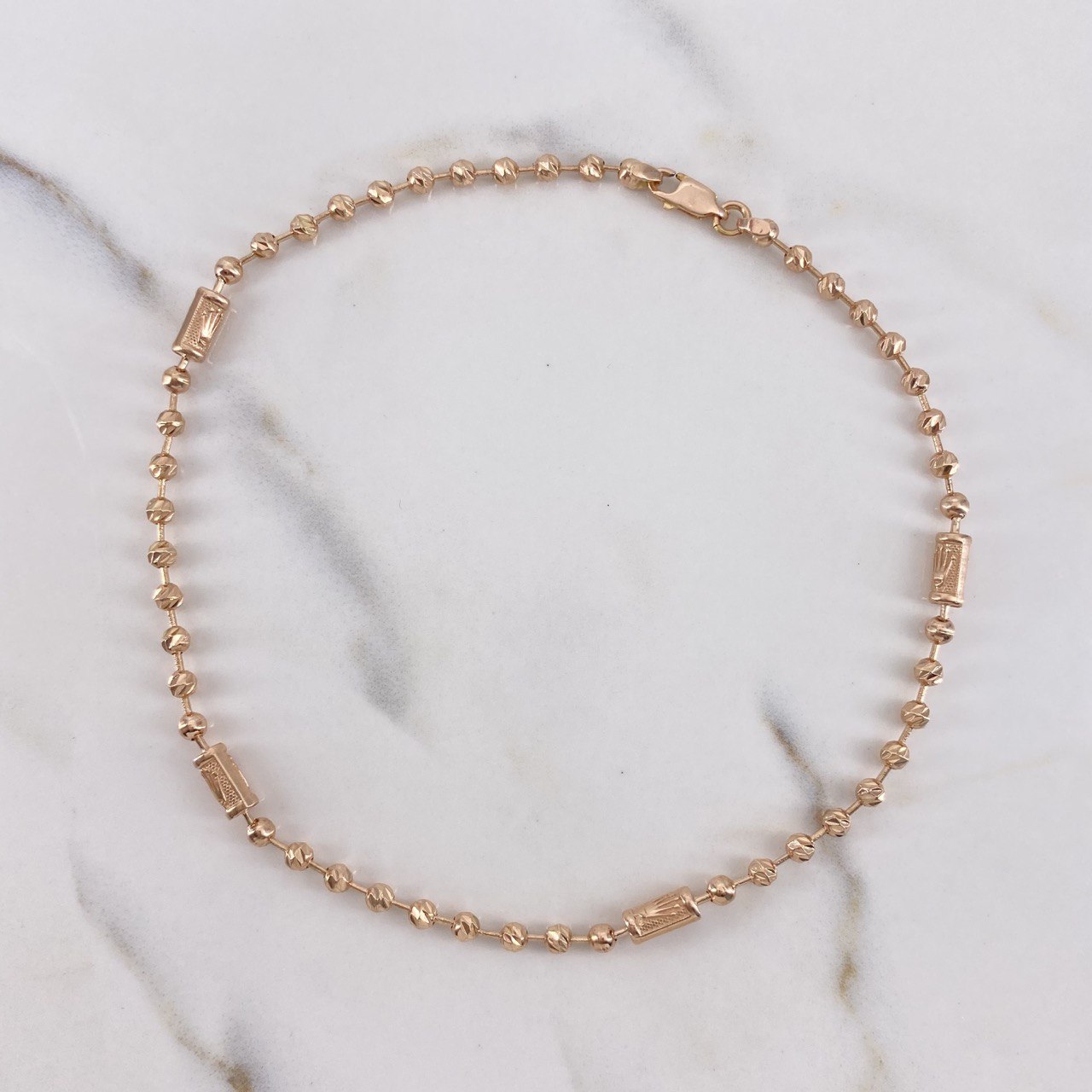 Tobillera Militar Corona 9.55gr / 28.5cm / 3mm-4mm Bolas Lisa-Diamantadas Oro Rosa $