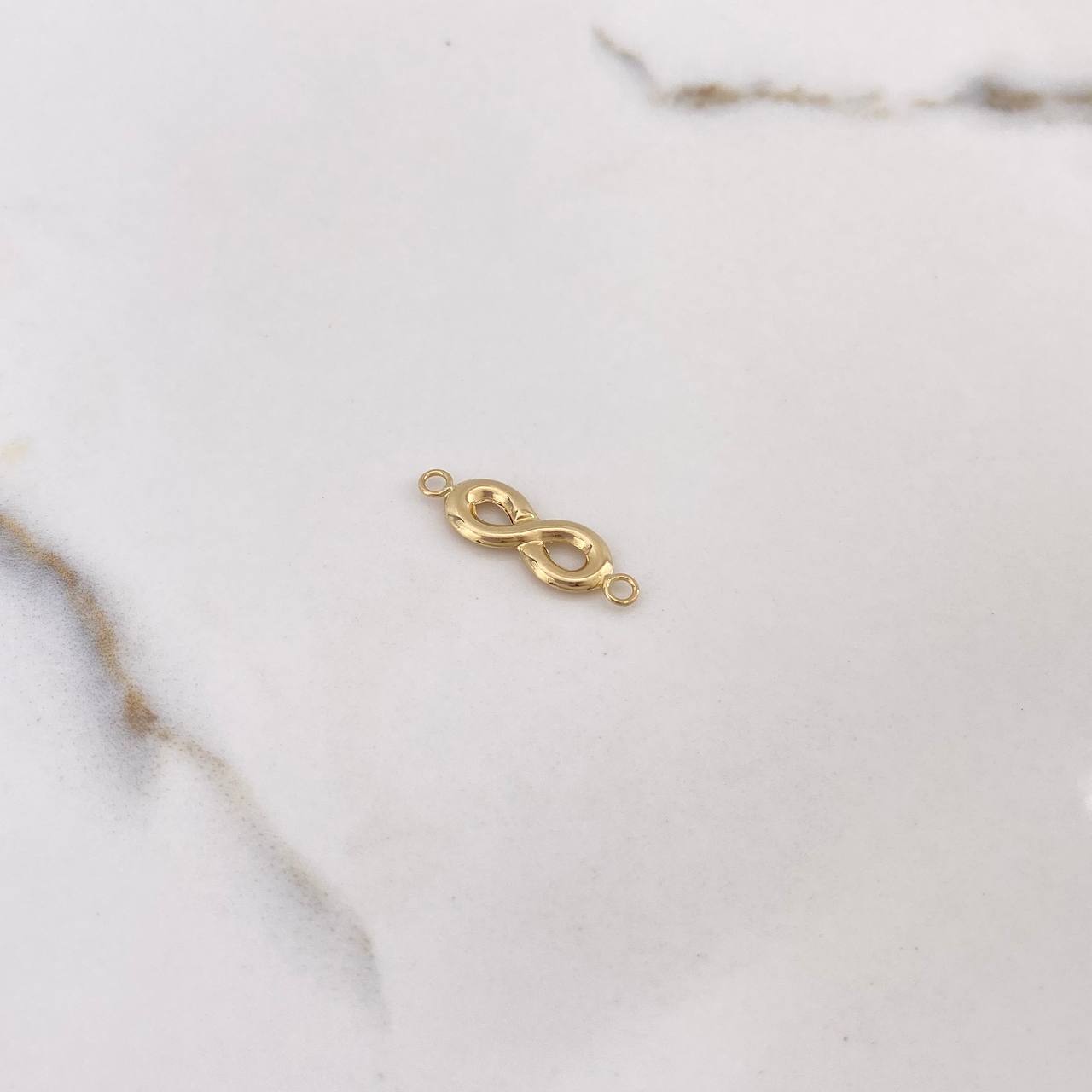 Herraje Infinito 0.75gr / 2.4cm / Oro Amarillo $