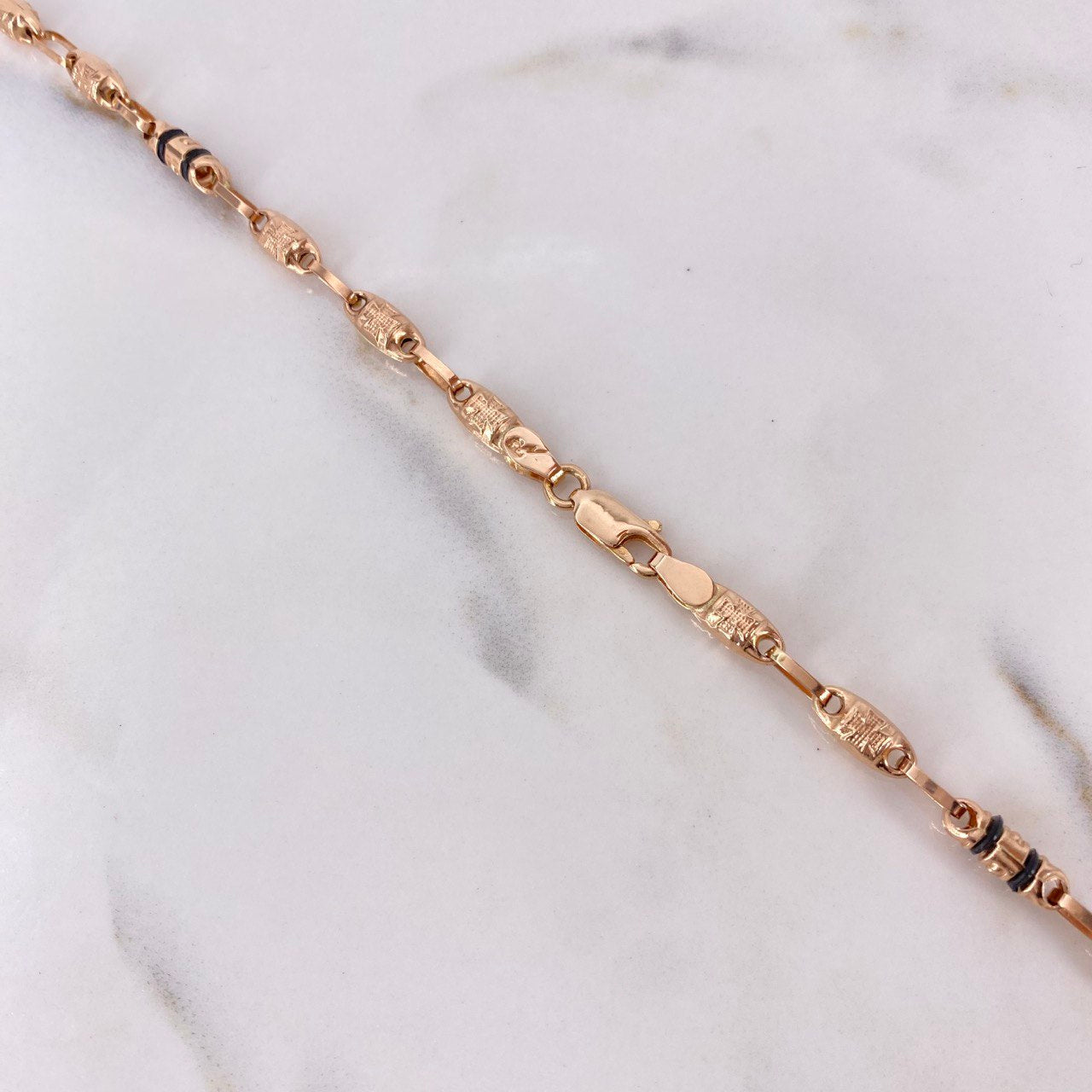 Cadena Rustica 12.9gr / 60cm / 5mm Barril Cruz Oro Rosa $