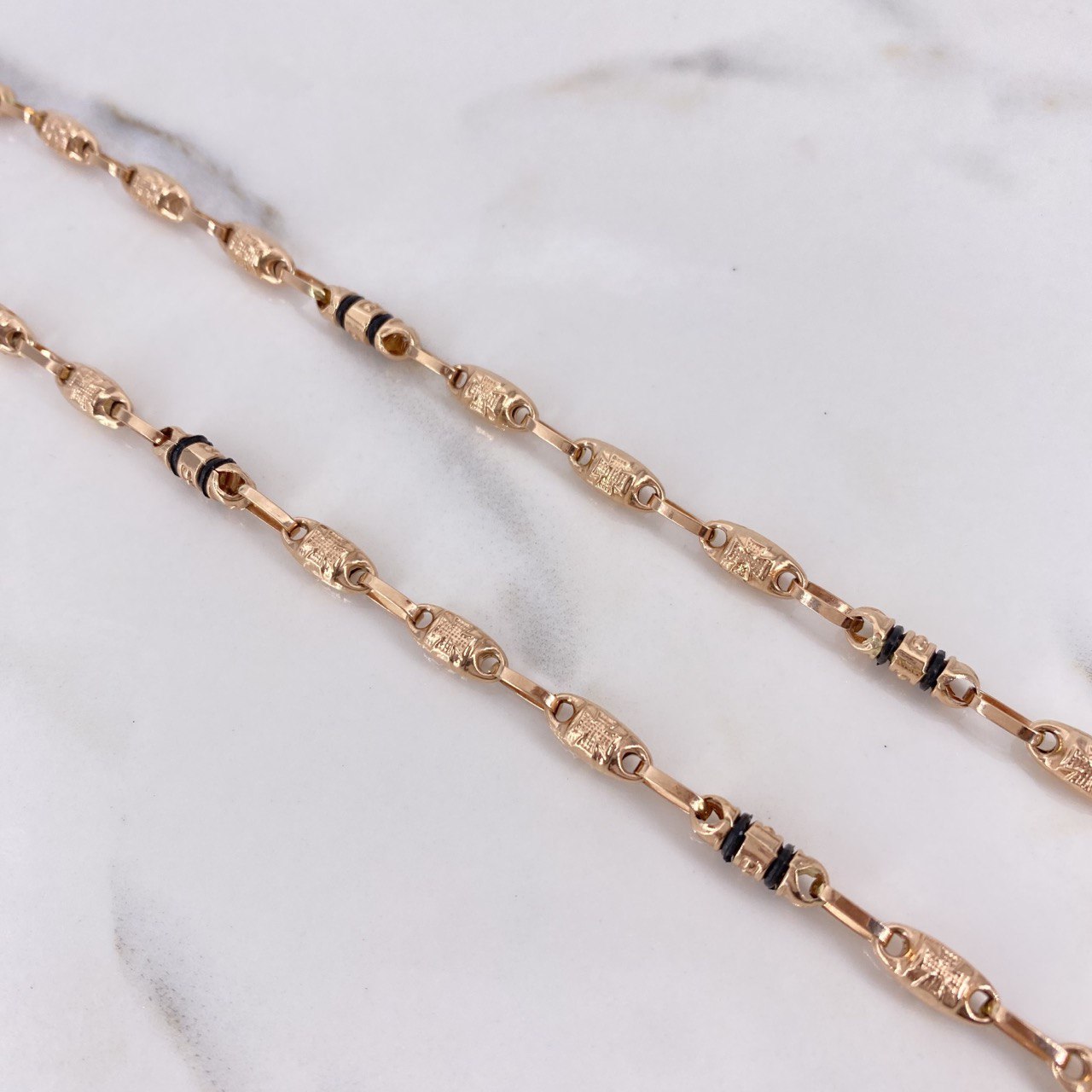 Cadena Rustica 12.9gr / 60cm / 5mm Barril Cruz Oro Rosa $