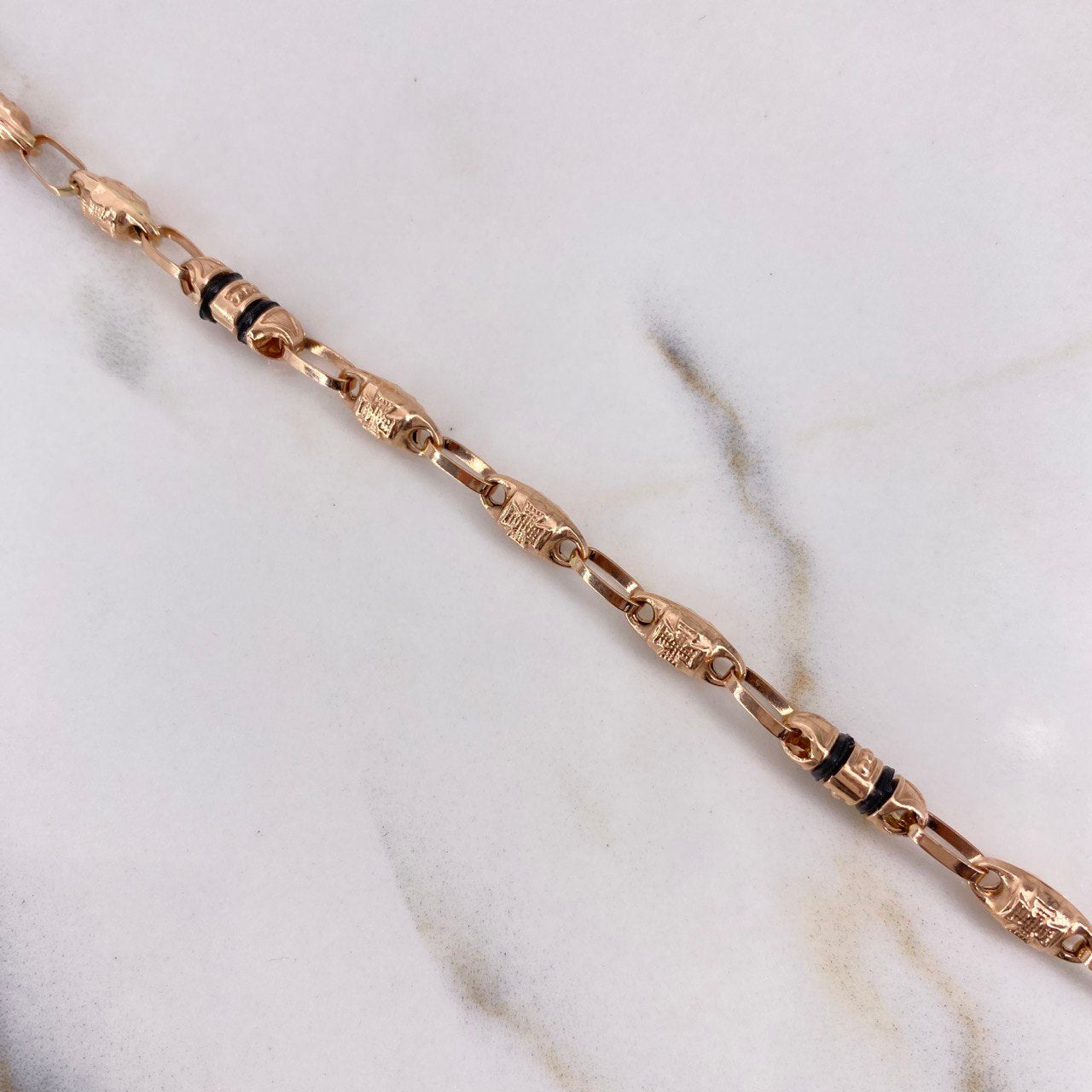 Cadena Rustica 12.9gr / 60cm / 5mm Barril Cruz Oro Rosa $