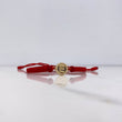 Pulsera Roja Herraje Letra E 0.55gr / 1.5cm / 5mm Troquelado Bolas Neoprenos Rojas Oro Amarillo $