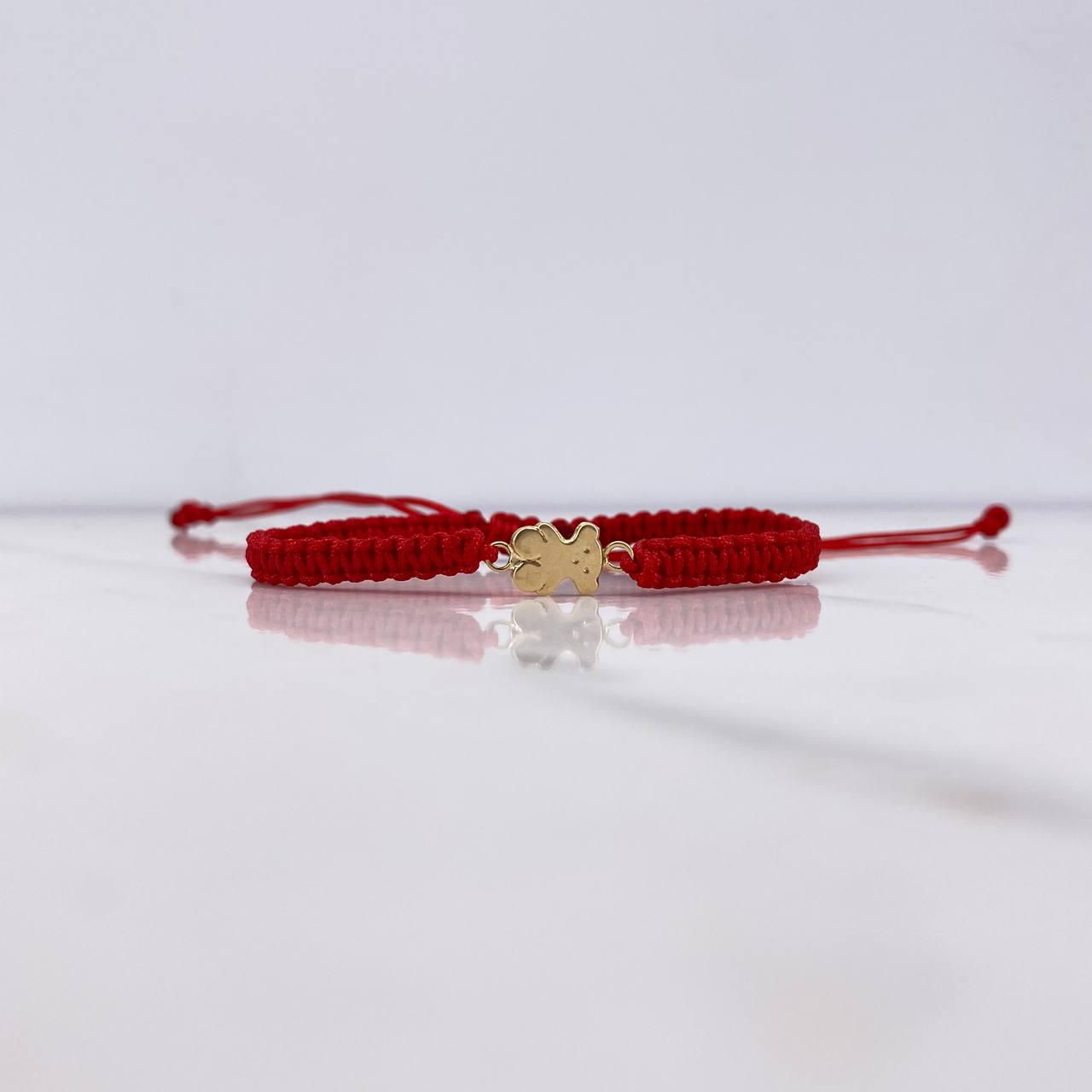 Pulsera Roja Oso Ts 0.3gr / 1.2cm / Oro Amarillo $