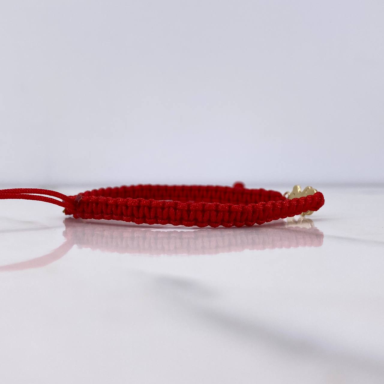 Pulsera Roja Oso Ts 0.3gr / 1.2cm / Oro Amarillo $