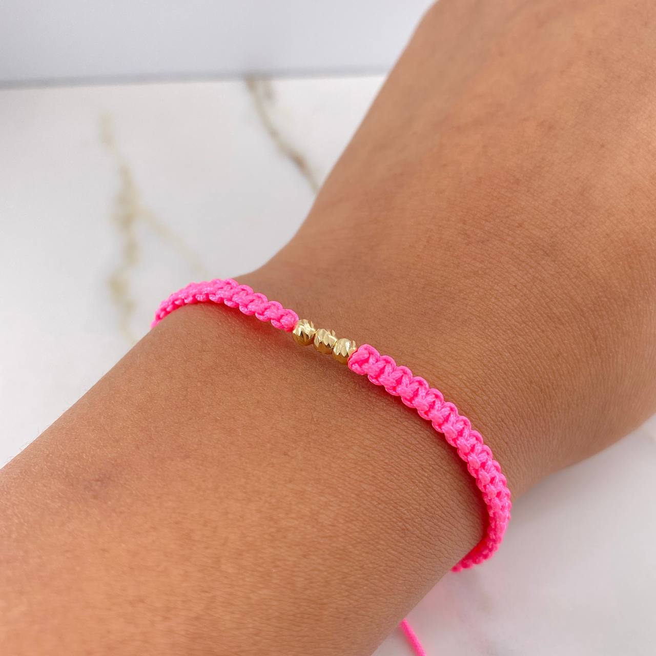 Pulsera Rosada Bolas Diamantadas 0.25gr / 3mm Oro Amarillo $
