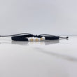 Pulsera Negra Bolas Diamantadas 0.25gr / 3mm Neoprenos Blancos Oro Amarillo $