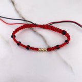 Pulsera Roja Bolas Diamantadas 0.25gr / 3mm Neoprenos Negros Oro Amarillo $
