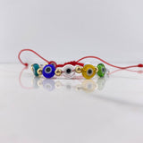 Pulsera Roja Ojos Turcos 0.85gr / 4mm Bolas Lisas Oro Amarillo $