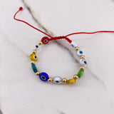 Pulsera Roja Ojos Turcos 0.85gr / 4mm Bolas Lisas Oro Amarillo $