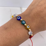 Pulsera Roja Ojos Turcos 0.85gr / 4mm Bolas Lisas Oro Amarillo $