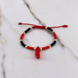 Pulsera Roja Negra Mostazilla 0.55gr / 3mm Pie Bolas Diamantadas Oro Amarillo $