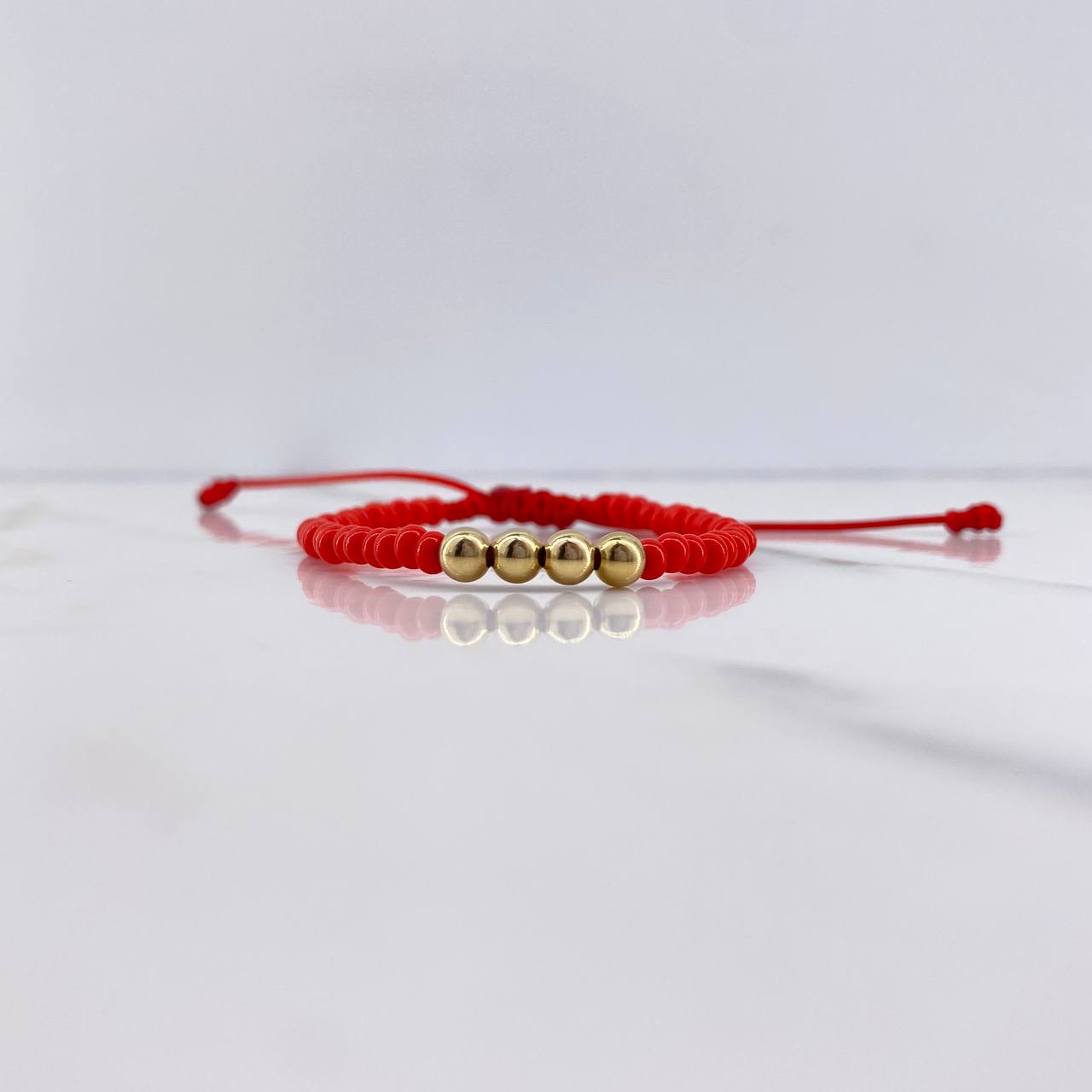 Pulsera Roja Mostazilla 0.35gr / 4mm Bolas Lisas Oro Amarillo $