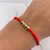 Pulsera Roja Mostazilla 0.35gr / 4mm Bolas Lisas Oro Amarillo $