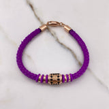Pulso Corona RX 6.05gr / 18cm / Caucho Morado Circones Negros Oro Rosa $