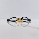 Pulsera Negra Argollas Tornillo 3.1gr / Lisas Oro Amarillo $