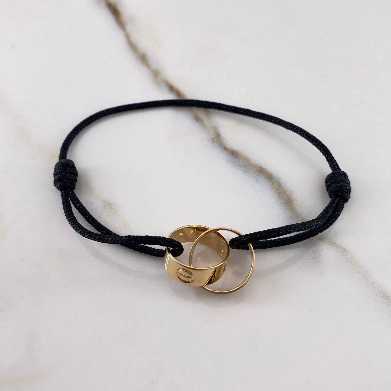 Pulsera Negra Argollas Tornillo 3.1gr / Lisas Oro Amarillo $