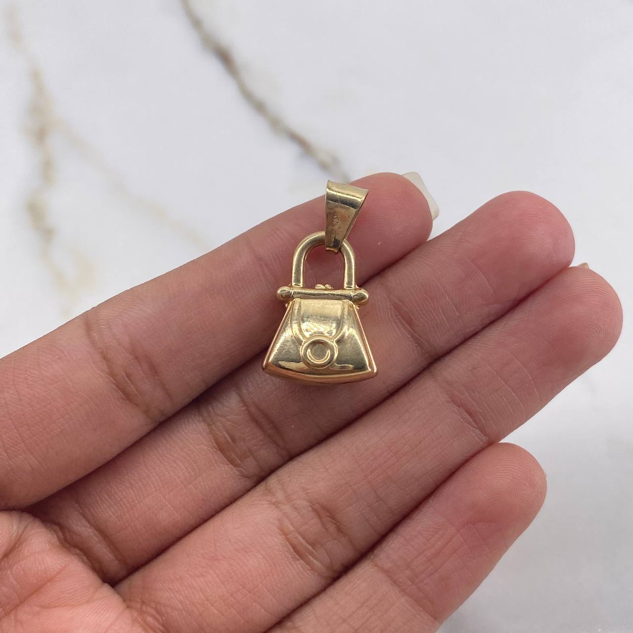 Dije Bolso 1.7gr / 2cm / Troquelado Oro Amarillo $