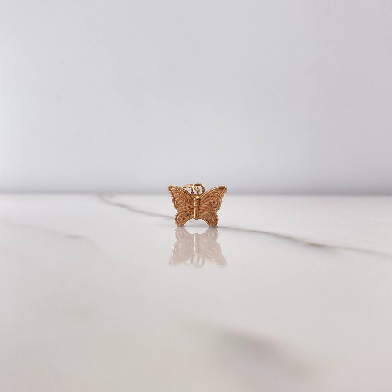 Dije Mariposa 0.45gr / 1.2cm / Oro Rosa $