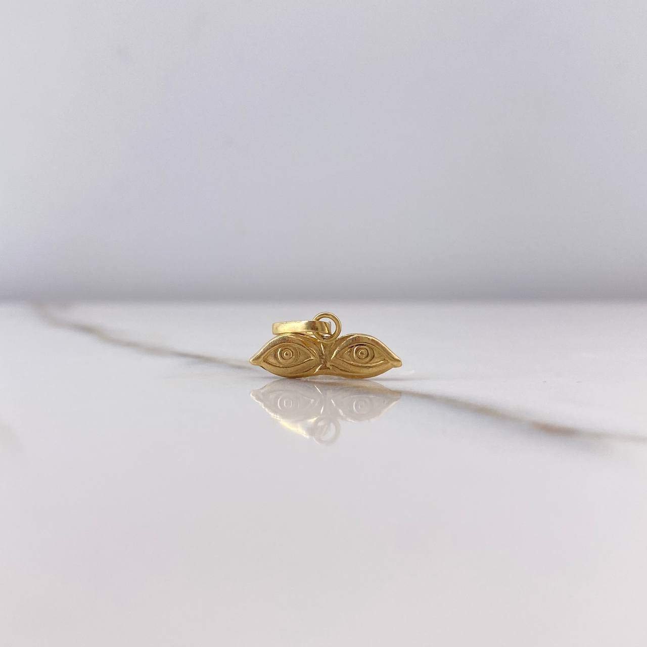 Dije Ojos de Santa Lucía 0.35gr / 1cm / Oro Amarillo $