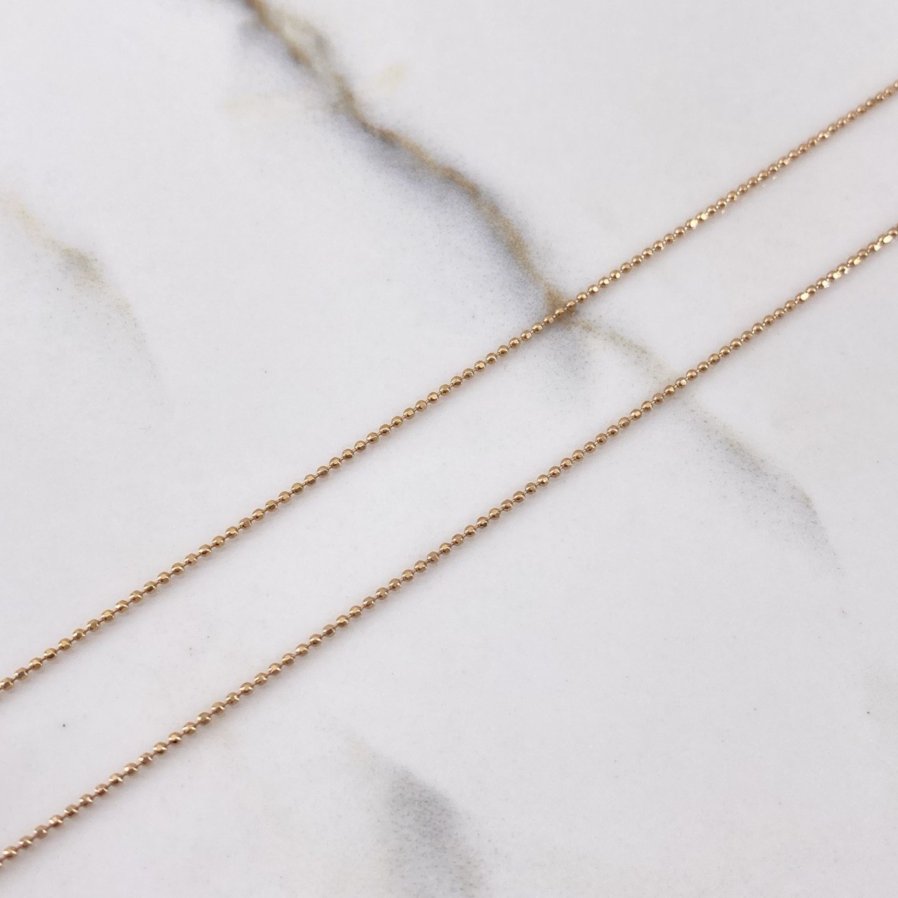 Cadena Militar 2.05gr / 45cm + Dije Corona RX Circones Negro 0.4gr / 1.5cm / Oro Rosa (Oferta) $