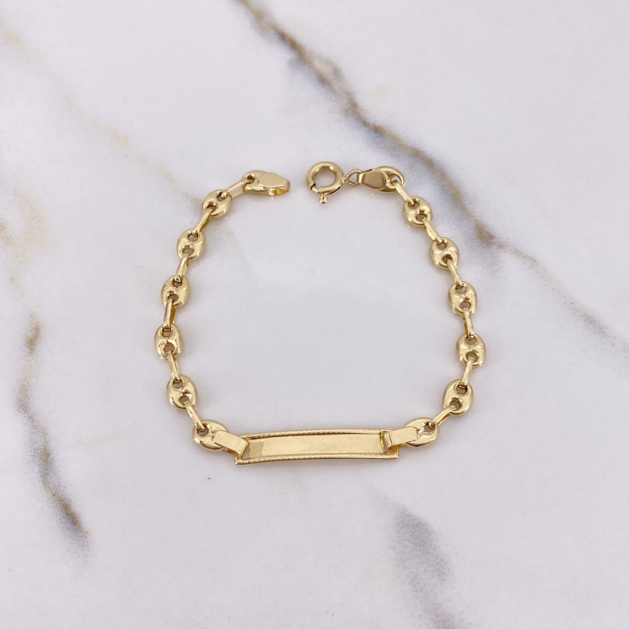 Pulso Bebé GC 2.6gr / 14cm / 4mm Placa Rectangular Bordeada Oro Amarillo $
