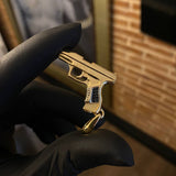 Dije Pistola 9.25gr / 4.5cm Circones Negros Dos Oros Amarillo Blanco