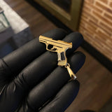 Dije Pistola 9.25gr / 4.5cm Circones Negros Dos Oros Amarillo Blanco