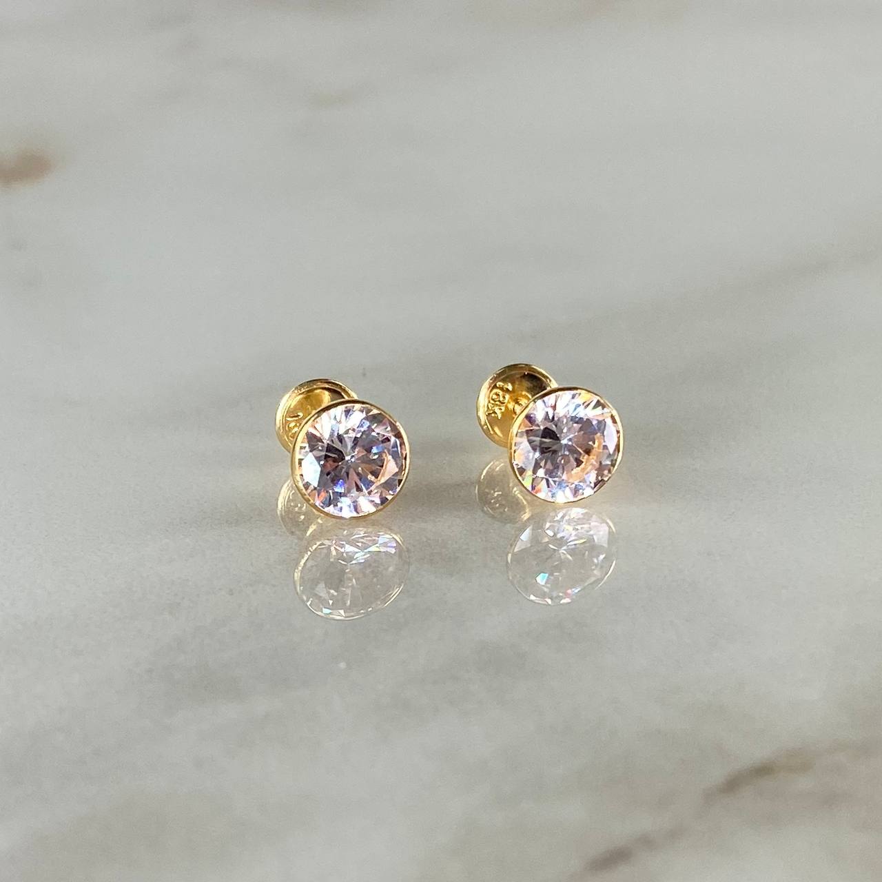 Topos Bisel 1.45gr / 7mm Circon Blanco Oro Amarillo 18K