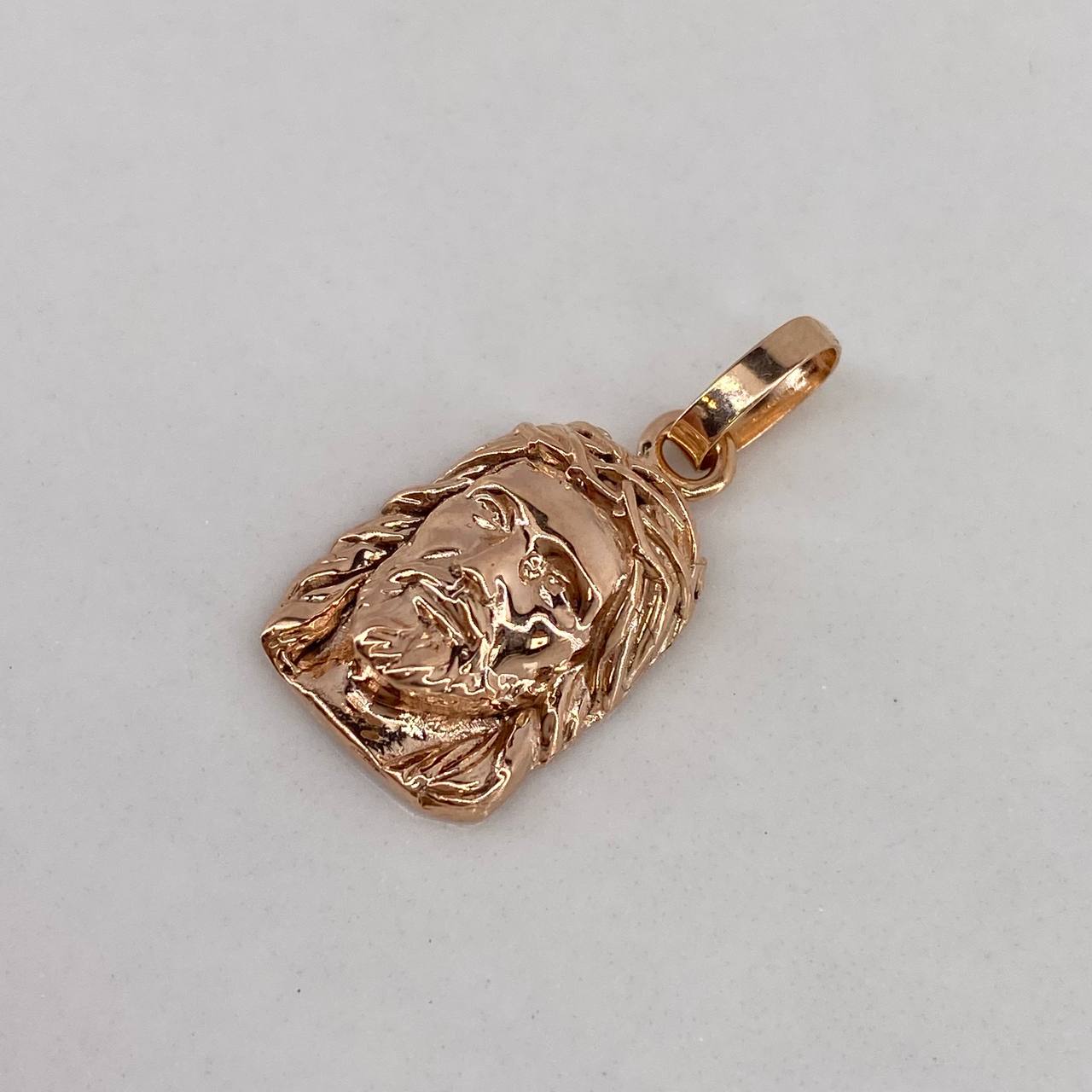 Dije Rostro de Cristo 1.9gr / 2cm / Liso Oro Rosa$