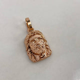 Dije Rostro de Cristo 1.9gr / 2cm / Liso Oro Rosa$