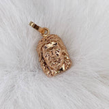 Dije Rostro de Cristo 1.9gr / 2cm / Liso Oro Rosa$