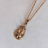 Dije Rostro de Cristo 1.25gr / 2cm / Circones Blancos Oro Rosa$