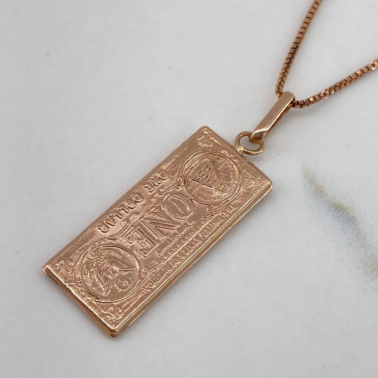 Dije Dollar  1.5gr / 3.5cm / Liso  Oro Rosa$