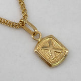 Dije Marco Letra X 0.35gr / 1.5cm / Liso  Oro Amarillo $