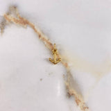 Dije Ancla  0.9gr / 1.5cm / Liso  Oro Amarillo &
