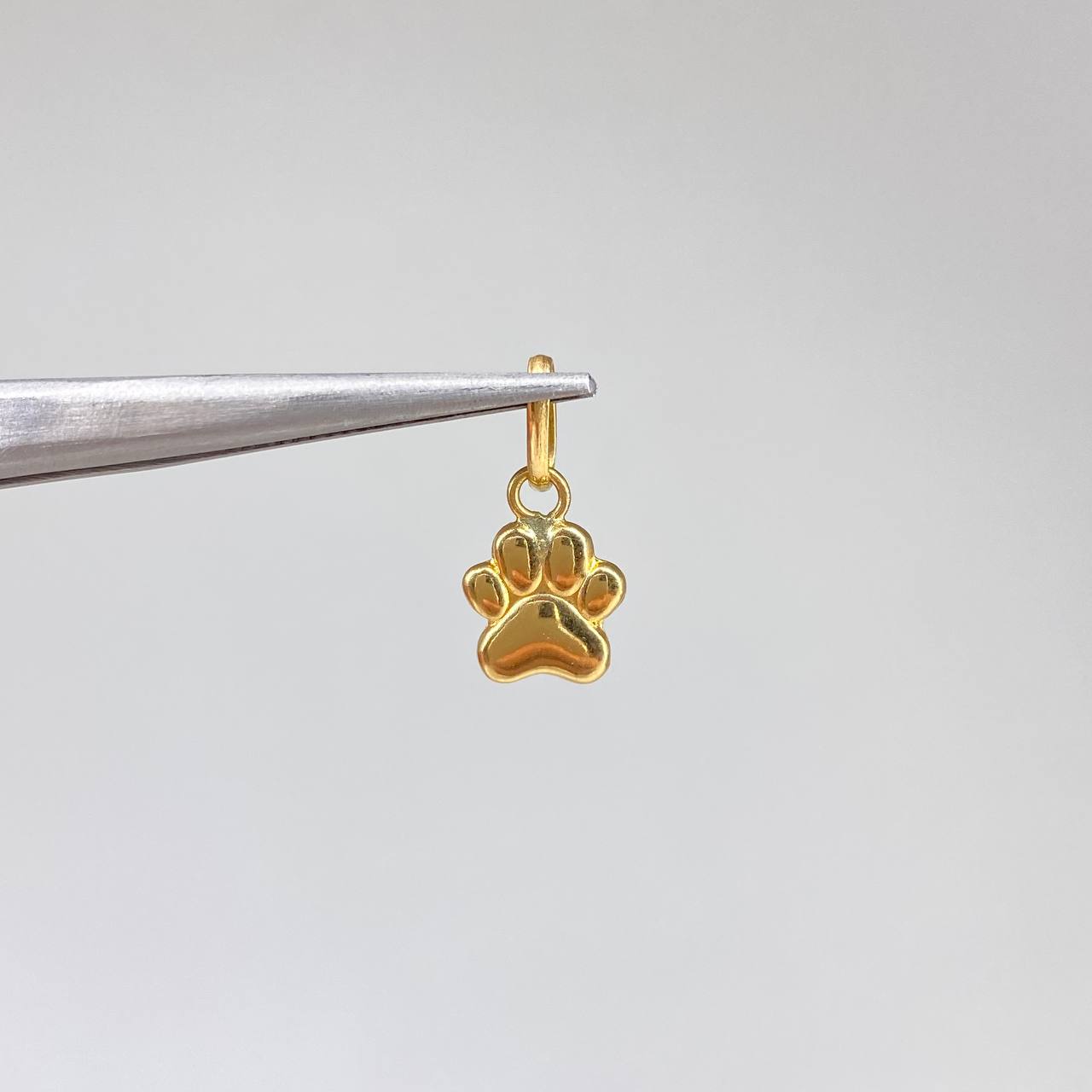 Dije Huella  0.55gr / 1.5cm / Liso  Oro Amarillo &