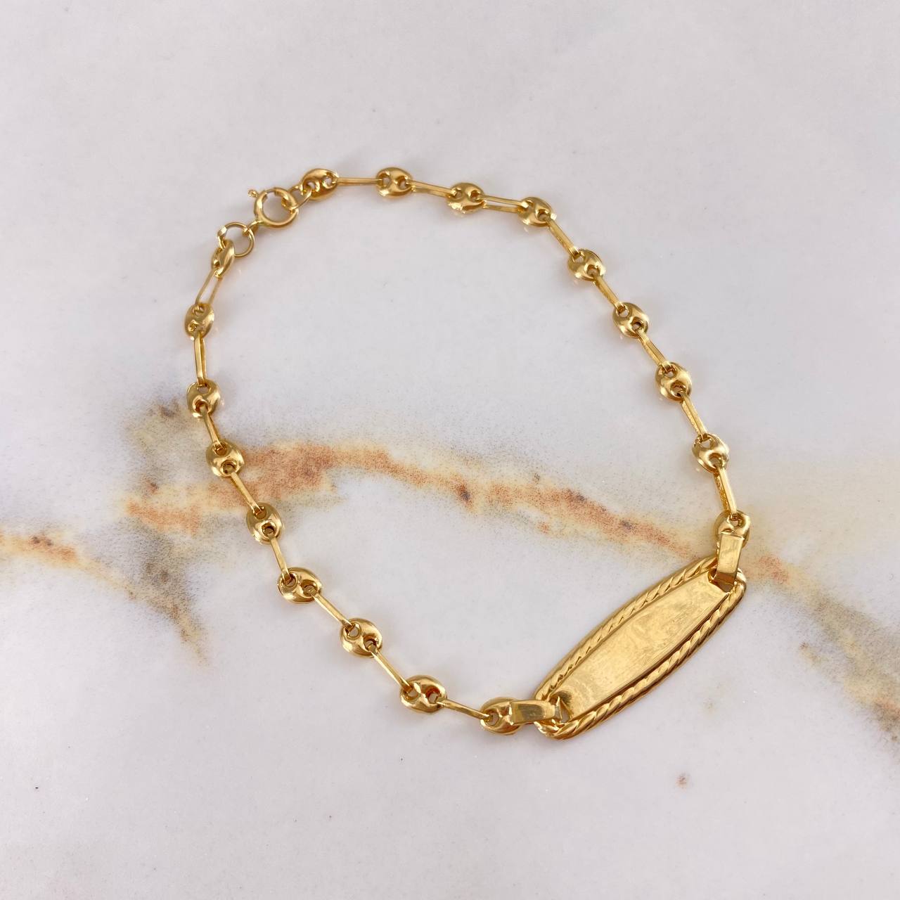 Pulso Bebé GC 1.6gr / 16cm / Placa Ovalada Relieve  Oro Amarillo &