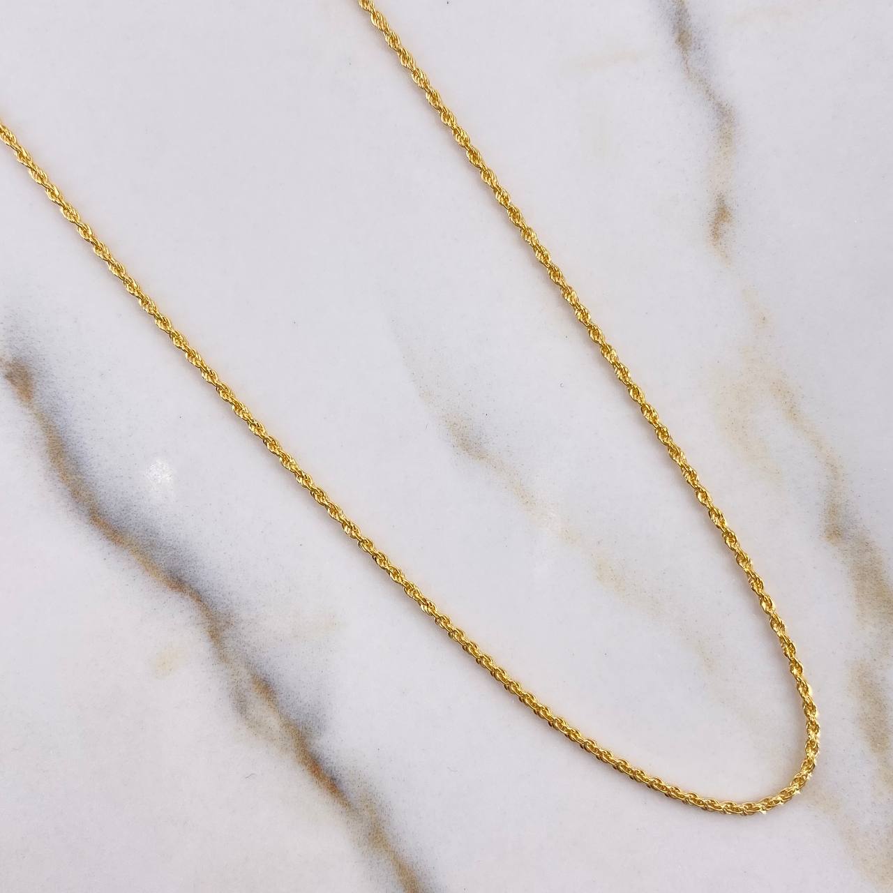 Cadena Lazo 0.95gr / 50cm + Dije Huella 0.30gr / 1.5cm Oro Amarillo (Oferta) $