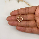Dije Corazón Silueta 1.15gr / 2.4cm / Troquelado Oro Rosa $