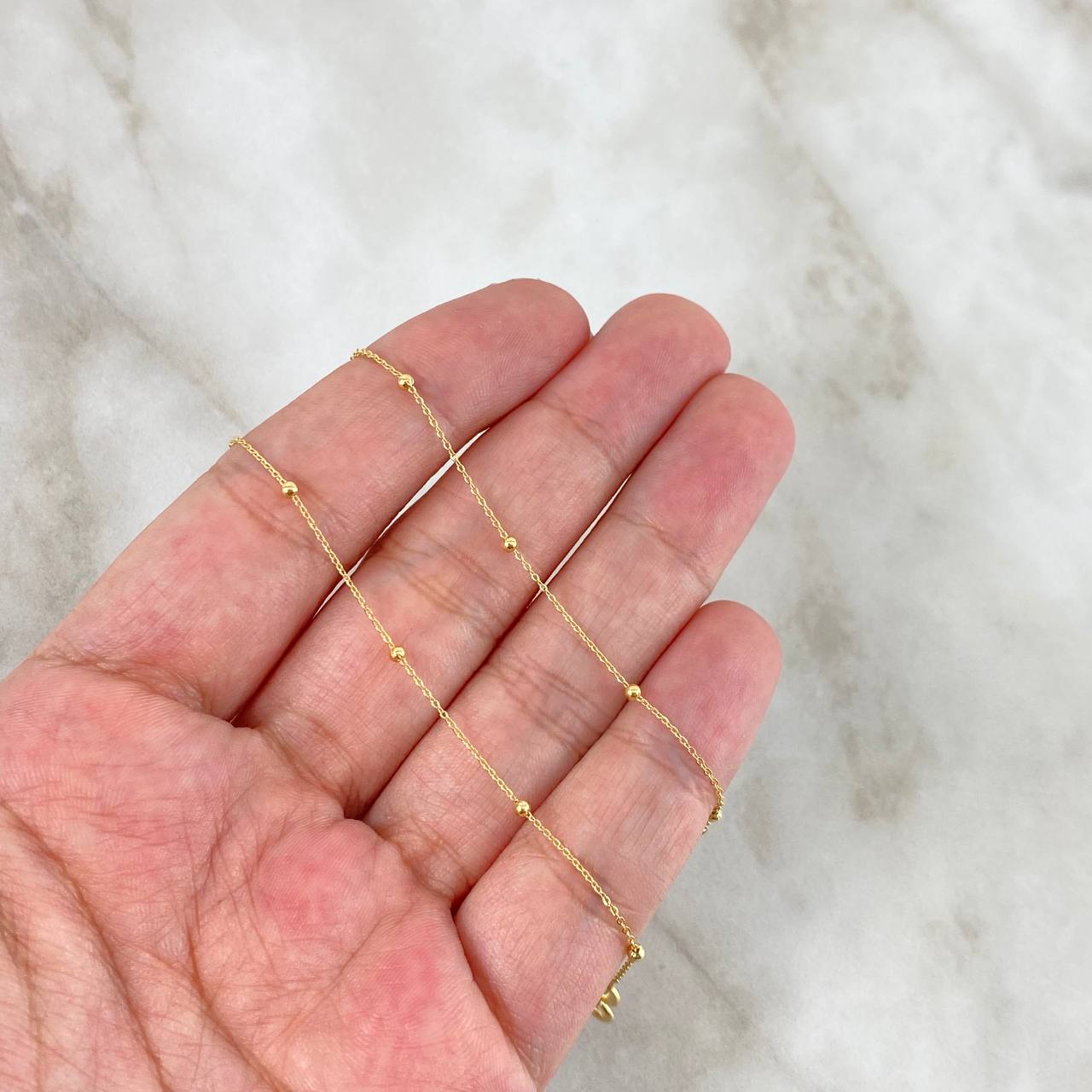 Tobillera Aro Seguido Tipo Militar 0.75gr / 25.5cm / 1mm Bola Lisa Oro Amarillo +3