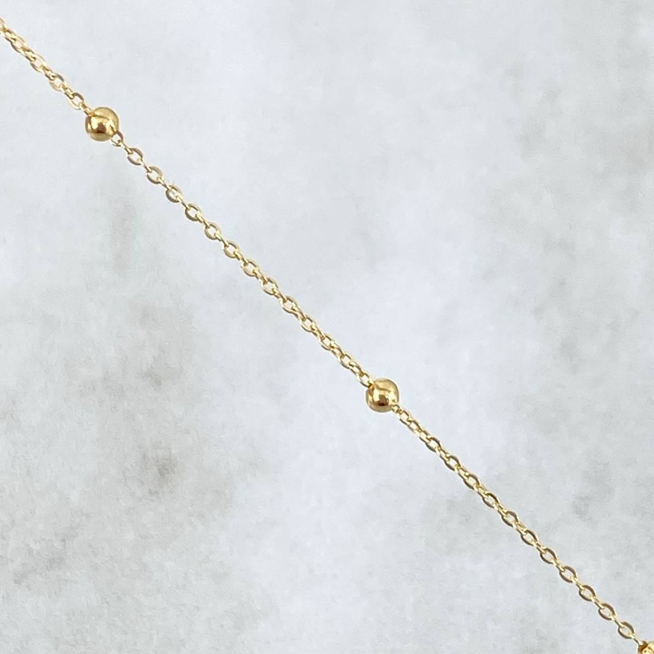 Tobillera Aro Seguido Tipo Militar 0.75gr / 25.5cm / 1mm Bola Lisa Oro Amarillo +3