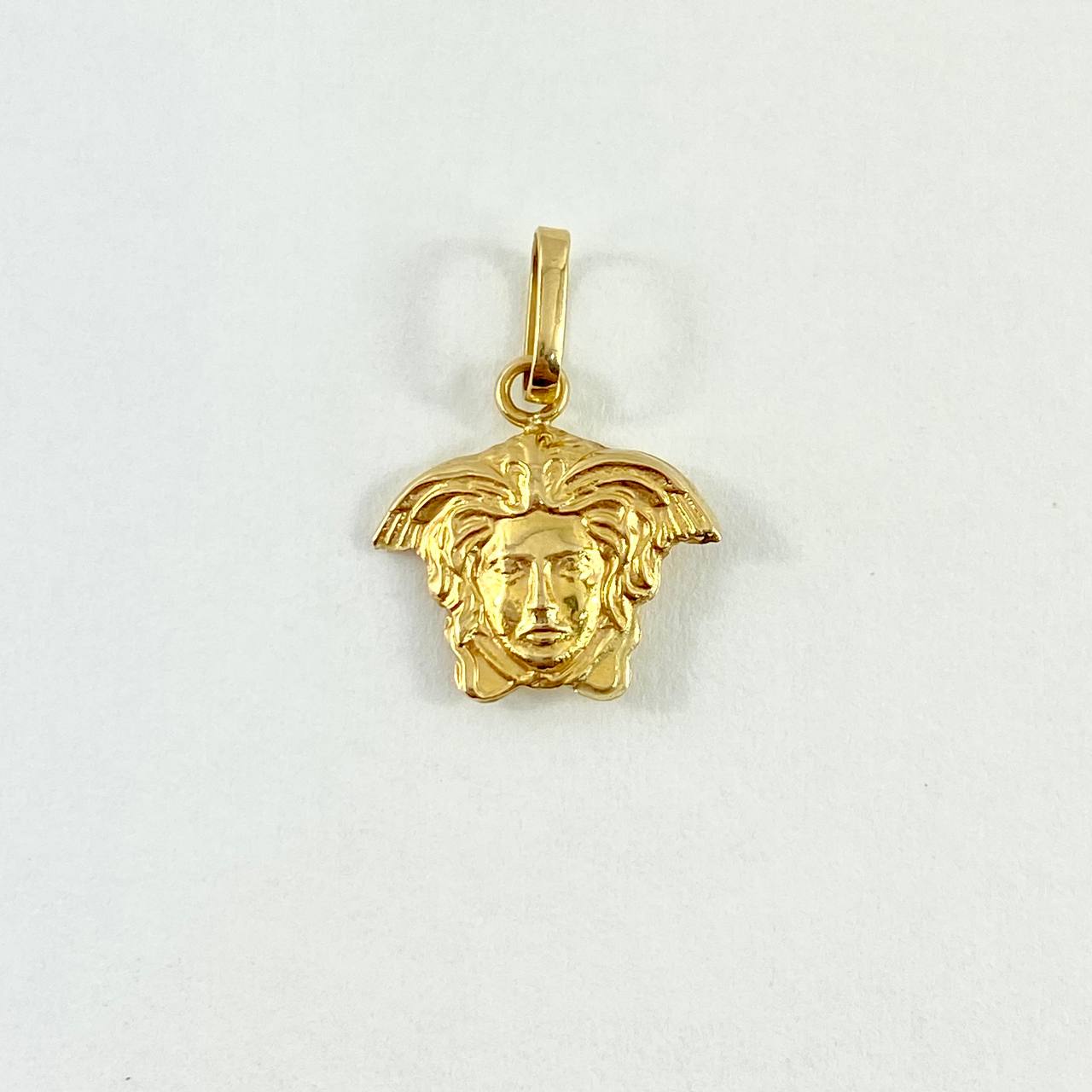 Dije Medusa 0.8gr / 1.8cm / Troquelado Oro Amarillo