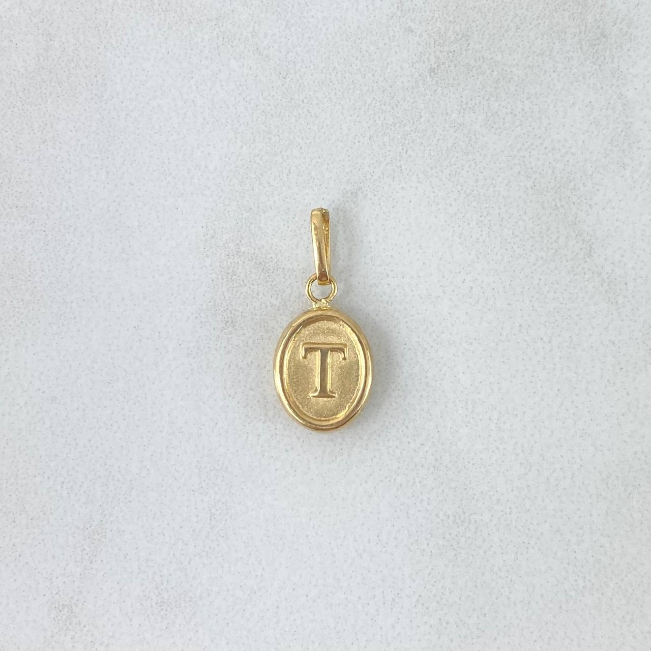 Dije Letra T Ovalada 0.55gr / 1.8cm / Troquelada Oro Amarillo ©