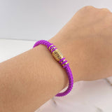 Pulso GG 6.4gr / 17cm / Caucho Morado Circones Blancos Oro Amarillo &
