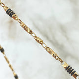 Cadena Rustica Barril Tallado 17.9gr / 55cm / Cauchos Negros Oro Amarillo