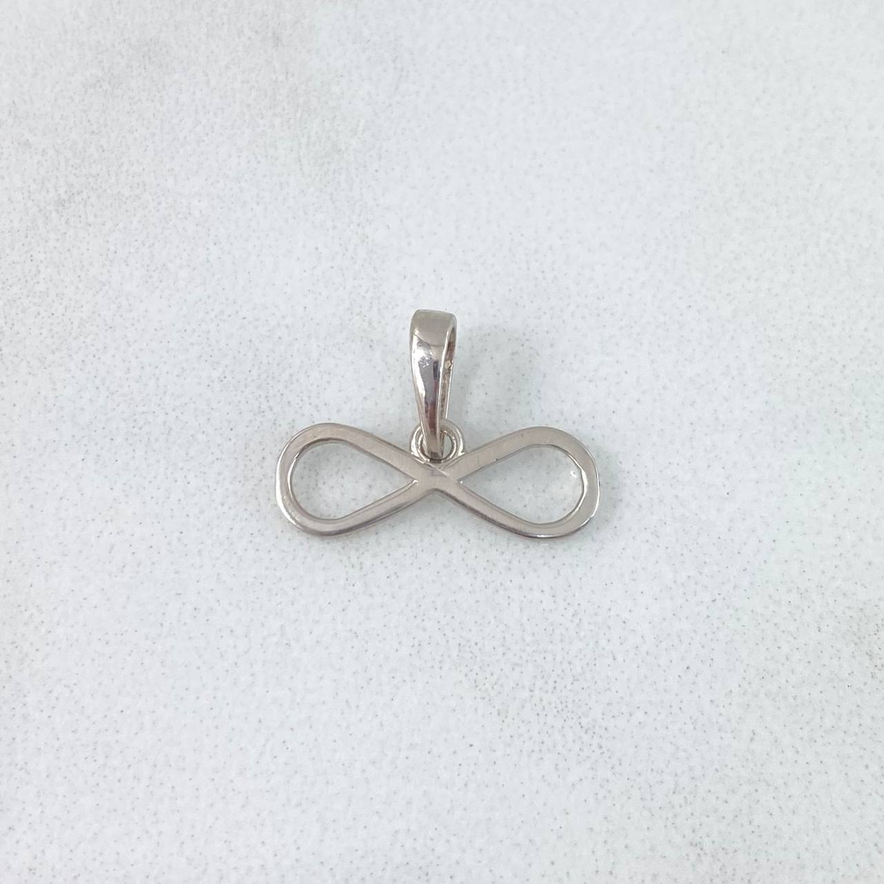 Dije Infinito 0.6gr / 1.2cm / Silueta Lisa Oro Blanco