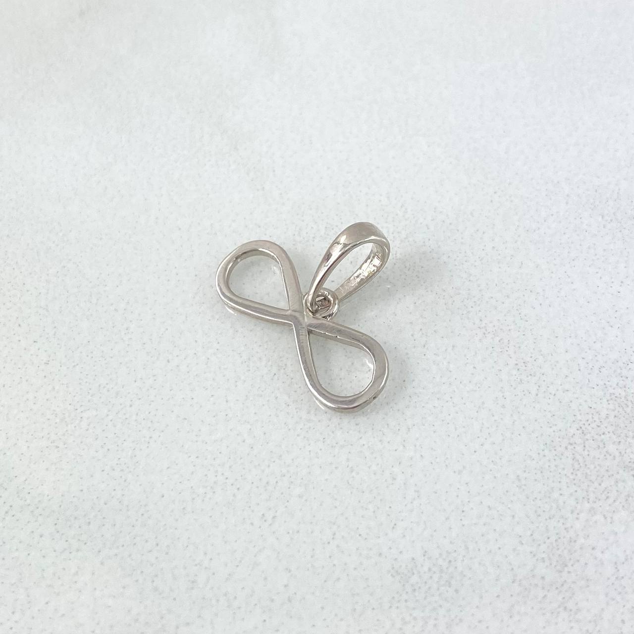 Dije Infinito 0.6gr / 1.2cm / Silueta Lisa Oro Blanco