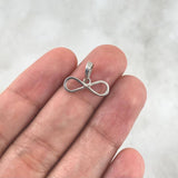 Dije Infinito 0.6gr / 1.2cm / Silueta Lisa Oro Blanco