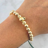 Pulsera Verde Calavera 4.8gr / 6mm Bolas Lisas - Diamantadas - Ojos Verdes Oro Amarillo 18K ©